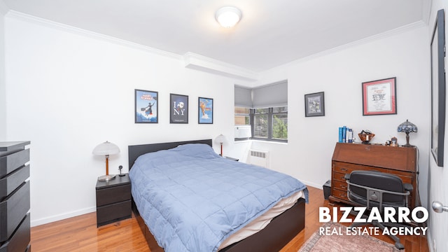 259 Bennett Ave Unit 2F, New York City, NY 10040 - bedroom with crown molding, wood finished floors, and radiator