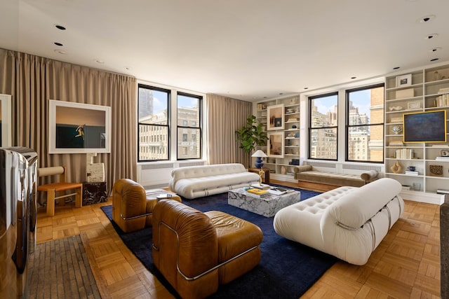 993 Park Ave Unit 11A, New York City, NY 10028 - living room featuring built in features and healthy amount of natural light