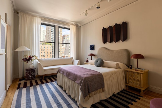 993 Park Ave Unit 11A, New York City, NY 10028 - bedroom with track lighting and light wood-type flooring