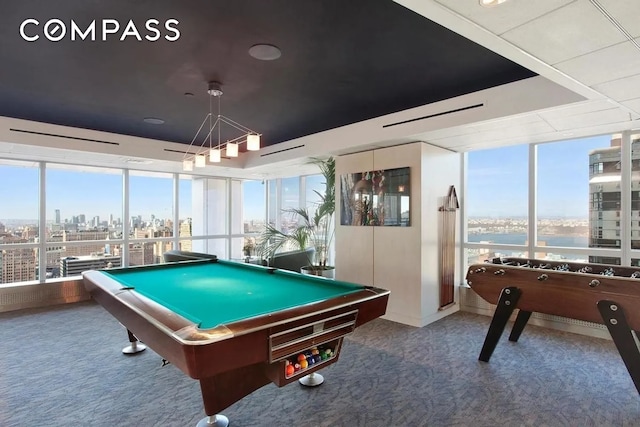 350 W 42nd St Unit 27K, New York City, NY 10036 - rec room featuring carpet, pool table, plenty of natural light, and a wall of windows