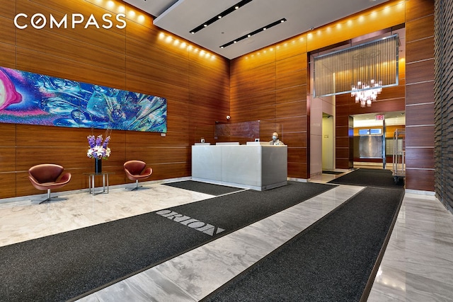 350 W 42nd St Unit 27K, New York City, NY 10036 - welcome area with a chandelier and wooden walls