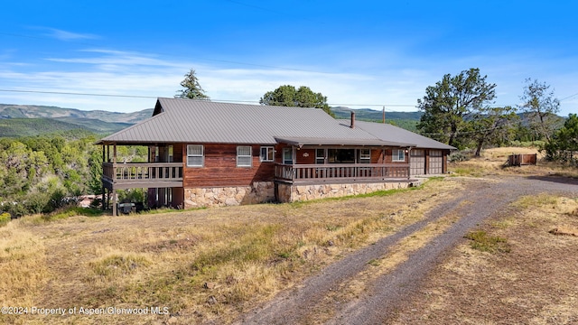 view of front of home featuring a mountain view