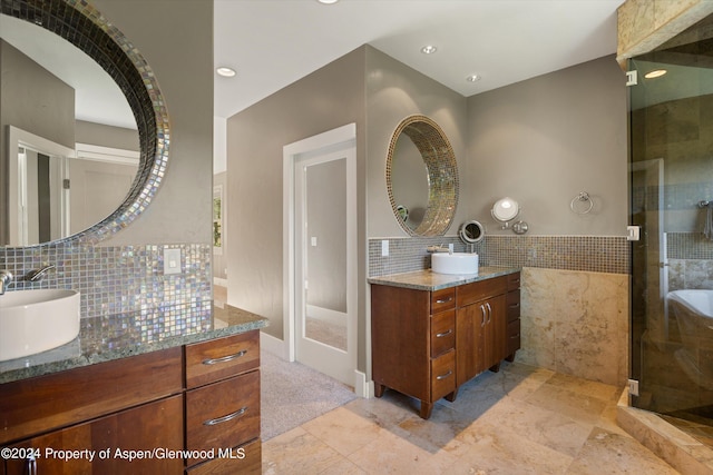 313 Cerise Ranch Rd, Carbondale, CO 81623 - full bathroom with two vanities, a stall shower, tasteful backsplash, and recessed lighting