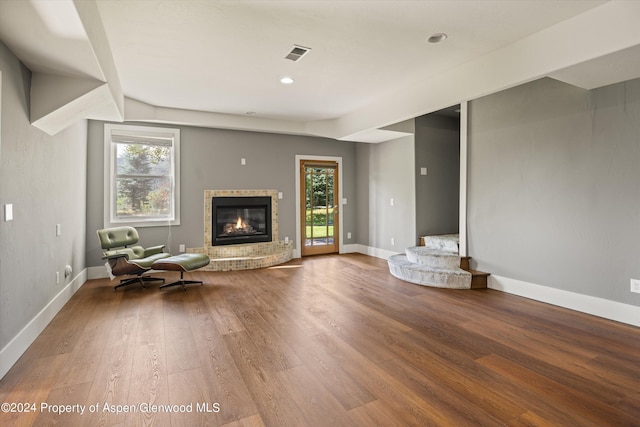 313 Cerise Ranch Rd, Carbondale, CO 81623 - living room featuring healthy amount of natural light, a fireplace, wood finished floors, baseboards, and recessed lighting
