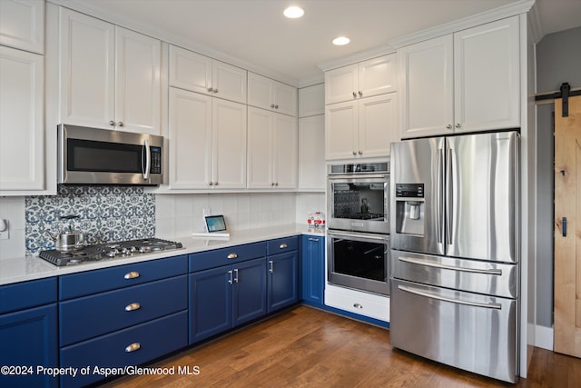 313 Cerise Ranch Rd, Carbondale, CO 81623 - kitchen featuring appliances with stainless steel finishes, blue cabinets, light countertops, dark wood-type flooring, and recessed lighting