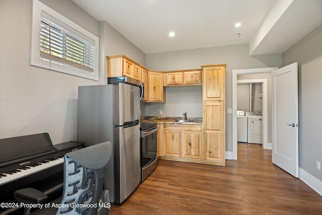 313 Cerise Ranch Rd, Carbondale, CO 81623 - kitchen with range with electric stovetop, light brown cabinets, freestanding refrigerator, washing machine and clothes dryer, and a sink