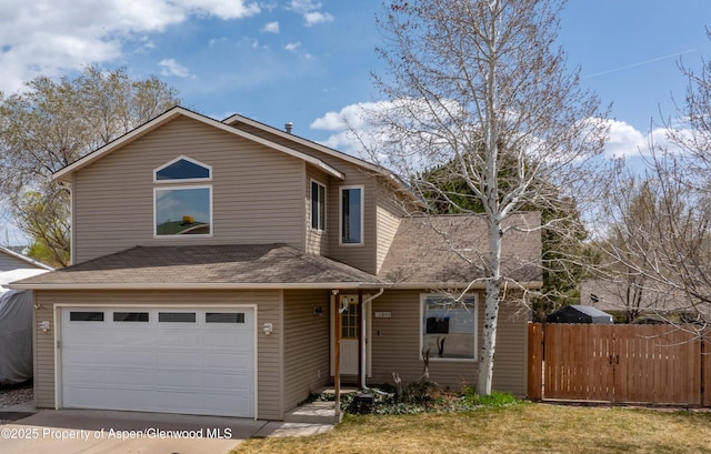 view of front of property featuring concrete driveway, a shingled roof, a garage, and fence