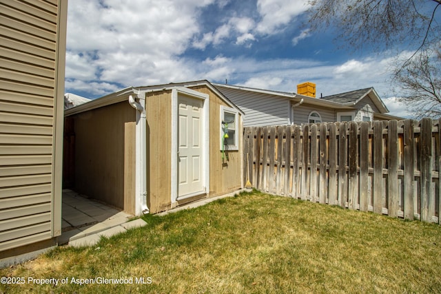 view of shed featuring fence