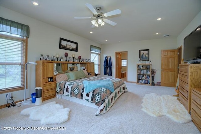 14651 County Road 3, Craig, CO 81625 - bedroom with baseboards, recessed lighting, light carpet, ceiling fan, and connected bathroom