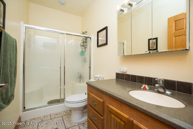 14651 County Road 3, Craig, CO 81625 - full bathroom with a shower stall, tile patterned flooring, and toilet