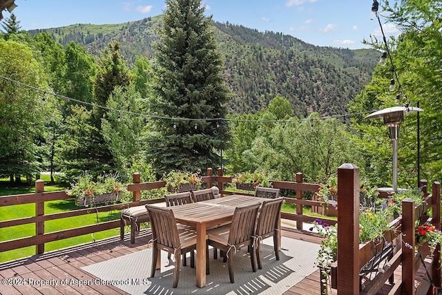 wooden deck with a mountain view