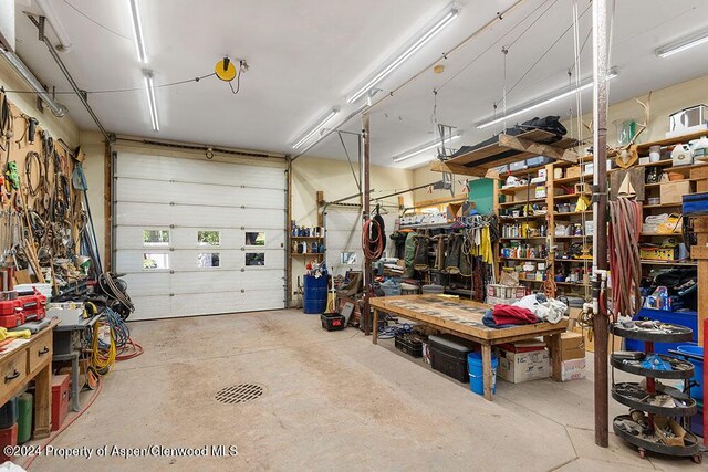 garage with a workshop area