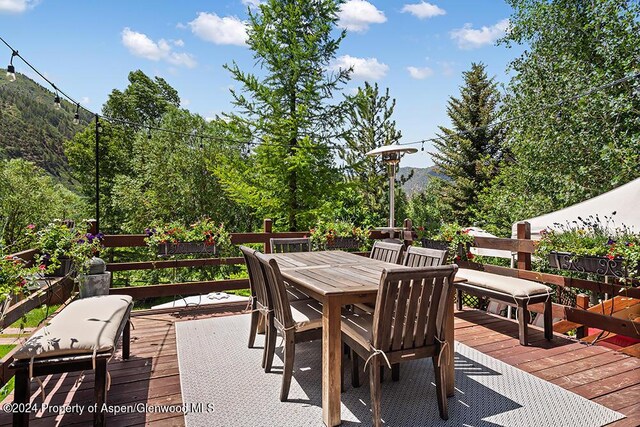 wooden terrace with a mountain view