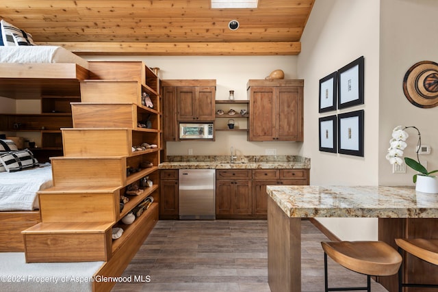 kitchen featuring light stone countertops, dark hardwood / wood-style flooring, sink, wooden ceiling, and dishwasher