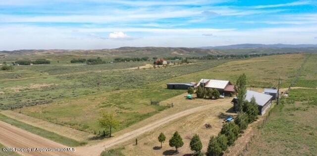 bird's eye view with a mountain view and a rural view