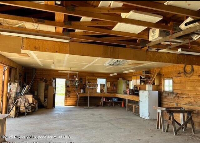garage with wood walls