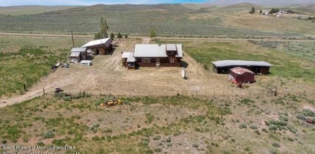 aerial view featuring a rural view and a mountain view
