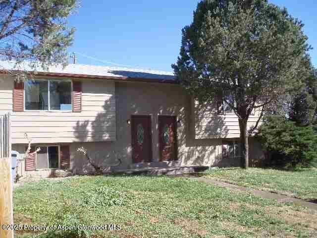 740 E 3rd St, Rifle, CO 81650 - raised ranch with a front lawn