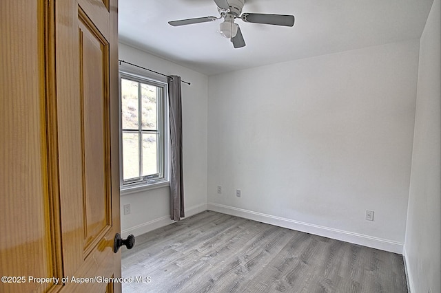 572 E Main St, New Castle, CO 81647 - spare room featuring plenty of natural light, light wood-style flooring, and a ceiling fan