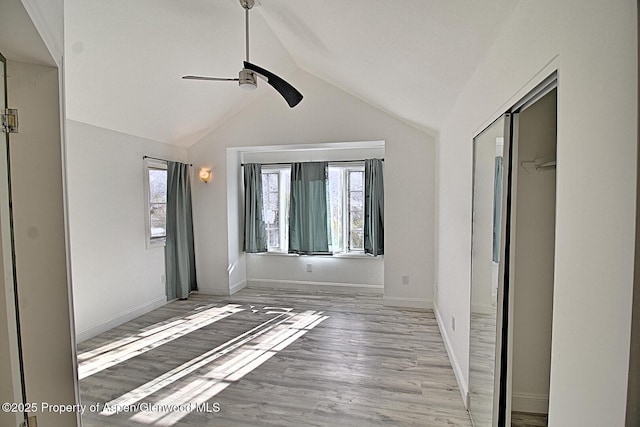 572 E Main St, New Castle, CO 81647 - unfurnished bedroom featuring lofted ceiling, light wood finished floors, a closet, and ceiling fan