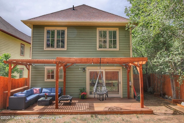 572 E Main St, New Castle, CO 81647 - rear view of house with an outdoor living space, a wooden deck, a pergola, and a fenced backyard