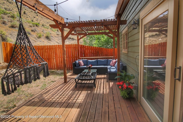 572 E Main St, New Castle, CO 81647 - wooden deck featuring an outdoor hangout area, a fenced backyard, and a pergola