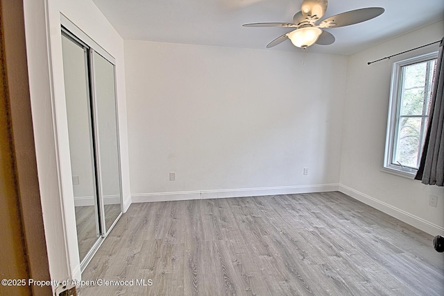 572 E Main St, New Castle, CO 81647 - unfurnished bedroom with light wood-type flooring, a closet, and ceiling fan