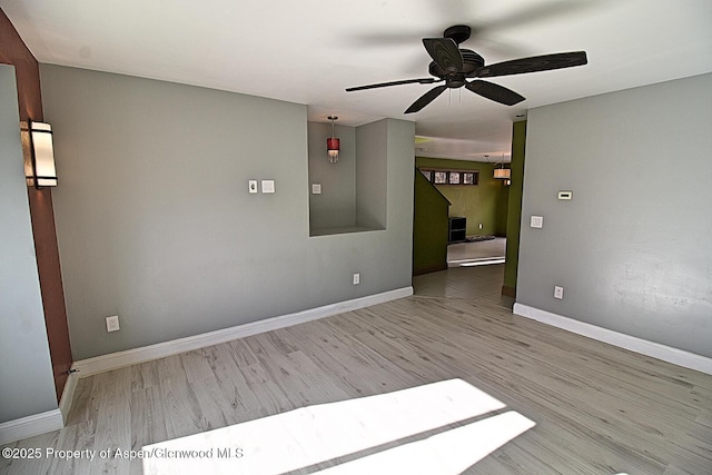 572 E Main St, New Castle, CO 81647 - empty room with a ceiling fan and wood finished floors