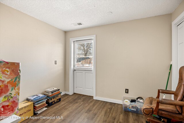 1101 Village Rd Unit Ll3B, Carbondale, CO 81623 - living room with wood finished floors, recessed lighting, and a textured ceiling