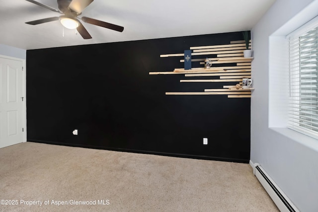 24 Lupine Ln, Parachute, CO 81635 - carpeted empty room featuring a baseboard heating unit and ceiling fan