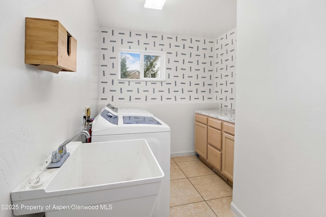 24 Lupine Ln, Parachute, CO 81635 - washroom featuring cabinet space, washer and clothes dryer, light tile patterned flooring, and baseboards