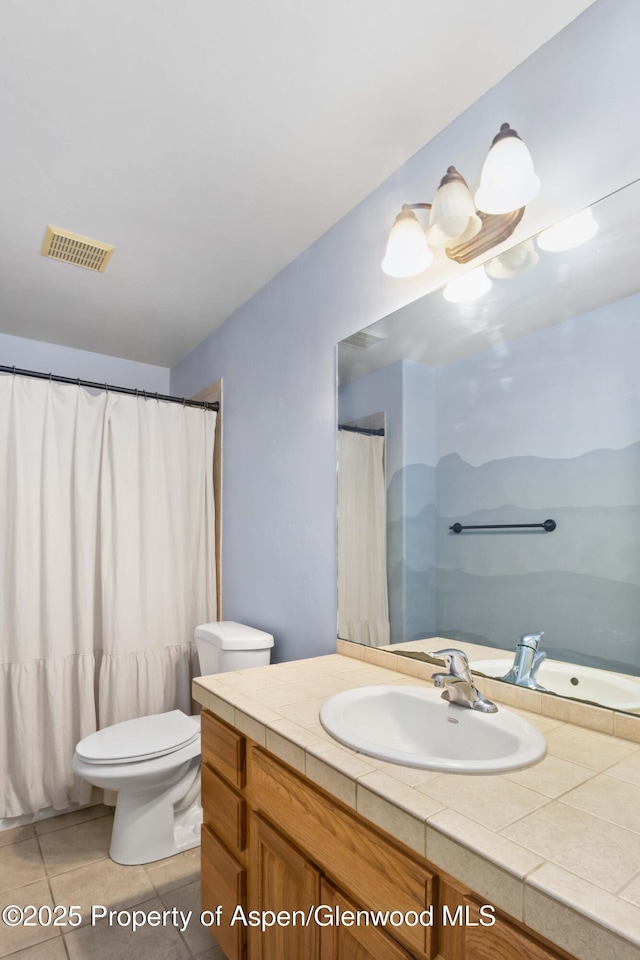 24 Lupine Ln, Parachute, CO 81635 - bathroom with toilet, tile patterned flooring, and vanity
