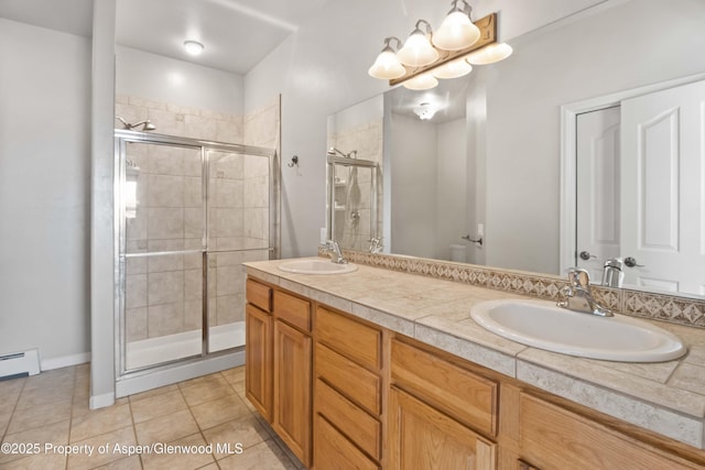 24 Lupine Ln, Parachute, CO 81635 - bathroom with a stall shower, tile patterned floors, and double vanity