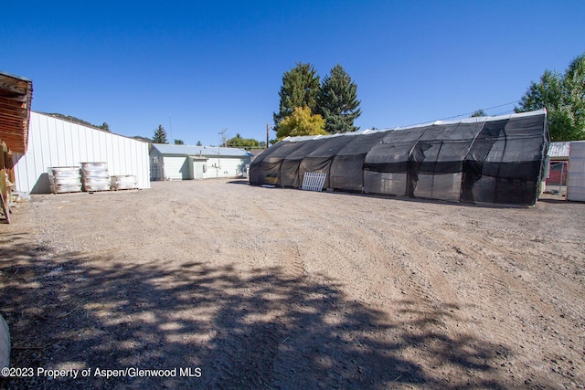 exterior space with an outbuilding