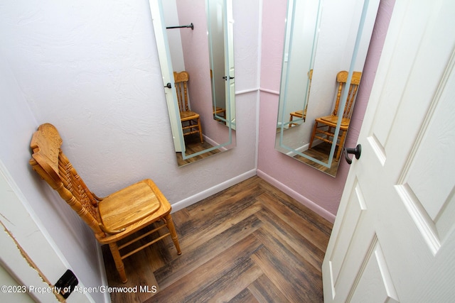 interior space featuring dark parquet floors