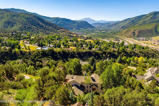 birds eye view of property with a mountain view