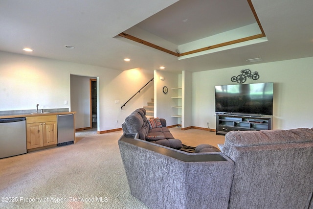 living room featuring recessed lighting, indoor wet bar, stairs, and light colored carpet