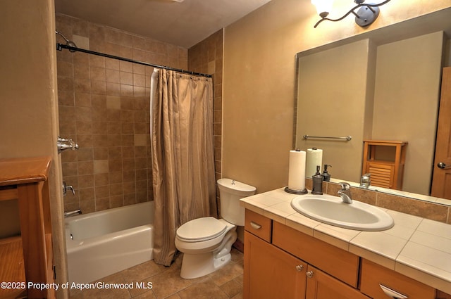 bathroom featuring shower / bath combo with shower curtain, tile patterned floors, toilet, and vanity