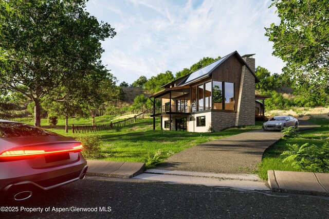 719 Perry Ridge Rdg, Carbondale, CO 81623 - view of home's exterior featuring a lawn, a chimney, and a wooden deck