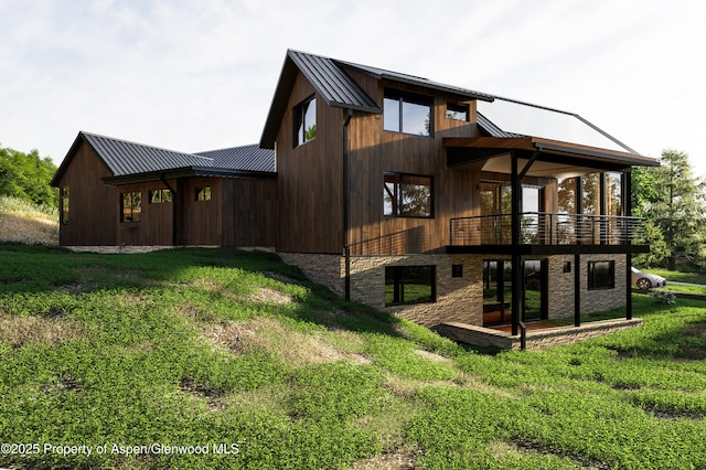 719 Perry Ridge Rdg, Carbondale, CO 81623 - back of house featuring metal roof, a yard, a standing seam roof, and stone siding