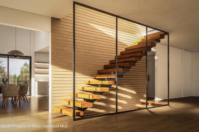 719 Perry Ridge Rdg, Carbondale, CO 81623 - stairs featuring wood finished floors and a towering ceiling