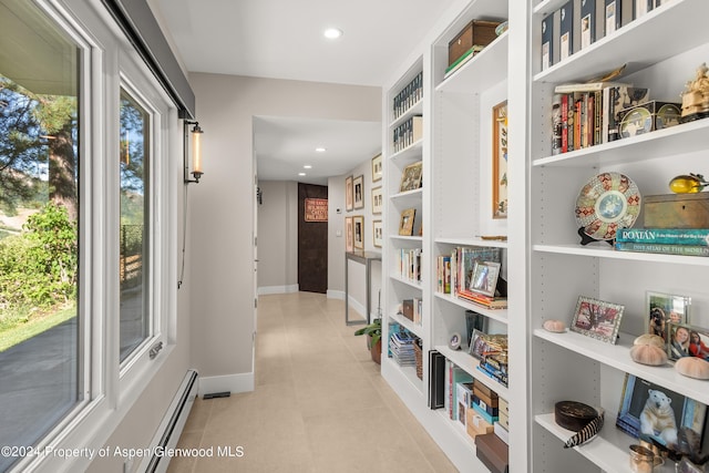 552 Mountain Laurel Dr, Aspen, CO 81611 - corridor with light tile patterned floors, a baseboard radiator, built in features, and recessed lighting