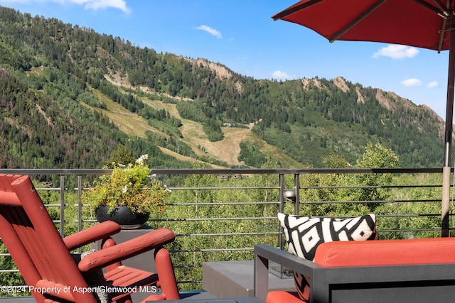 balcony featuring a mountain view