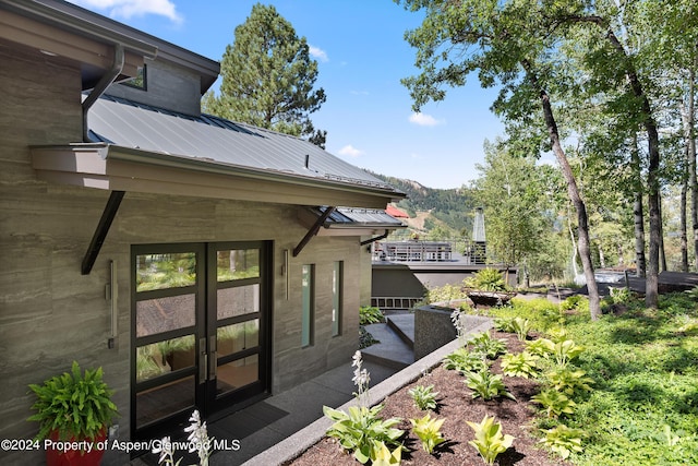 exterior space featuring a mountain view and french doors