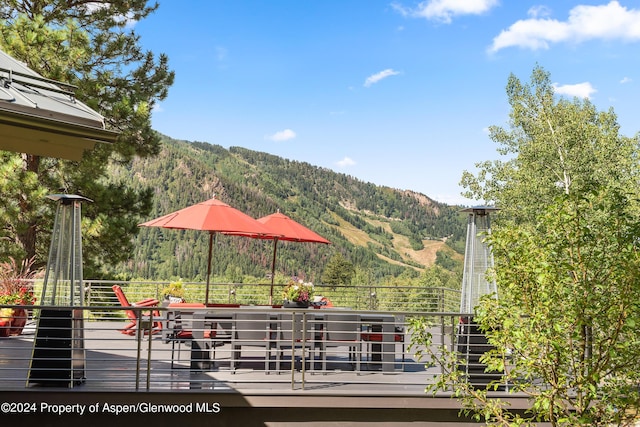 wooden deck featuring a mountain view