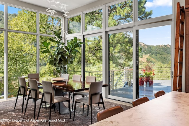 sunroom with a notable chandelier