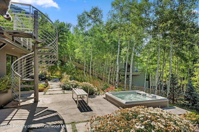 view of patio featuring an outdoor hot tub