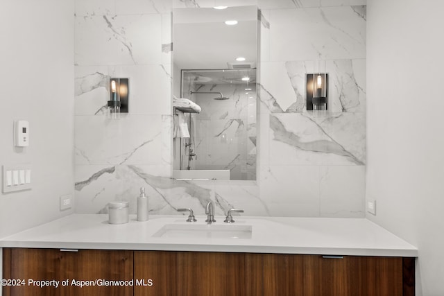 bathroom featuring vanity and a shower