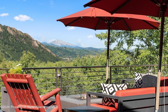 balcony featuring a mountain view