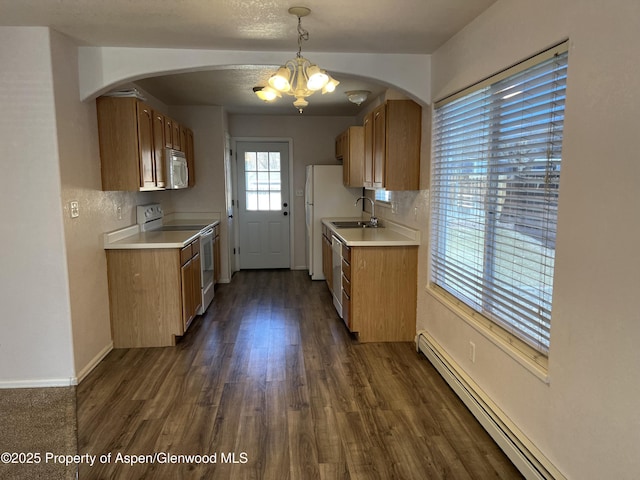 kitchen with dark wood finished floors, white electric range oven, light countertops, a baseboard heating unit, and a sink